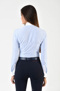 Ladies long sleeve shirt | technical fabric | lady long sleeve shirt | long sleeves shirt | long sleeves shirt | model SOFIA | long sleeves riding shirt | lady polo | lady riding shirt | riding shirt | ladies riding shirt | comfort of movement | Makebe | clothing | equestrian | riding | technical material | made in Italy | elegance | light blue | 