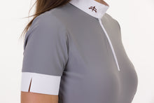 Load image into Gallery viewer, model SOLE | technical fabric | short sleeves shirt | short sleeves riding shirt | lady shirt | lady riding shirt | riding shirt | ladies riding shirt | lady riding polo shirt | comfort of movement | Makebe | clothing | equestrian | riding | technical material | made in Italy | elegance | grey |