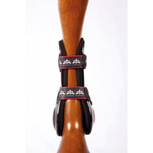 Laden Sie das Bild in den Galerie-Viewer, tendon boots | ship skin | tendon boots protection | Makebe | Horse accessories | Technical | riding accessories | equestrian | tendons protection | riding | lycra edging | avoid sores | breathable | neoprene | TPU | protection | ventilation | triple adjustement | elastic straps | central insert interchangeable | brown |